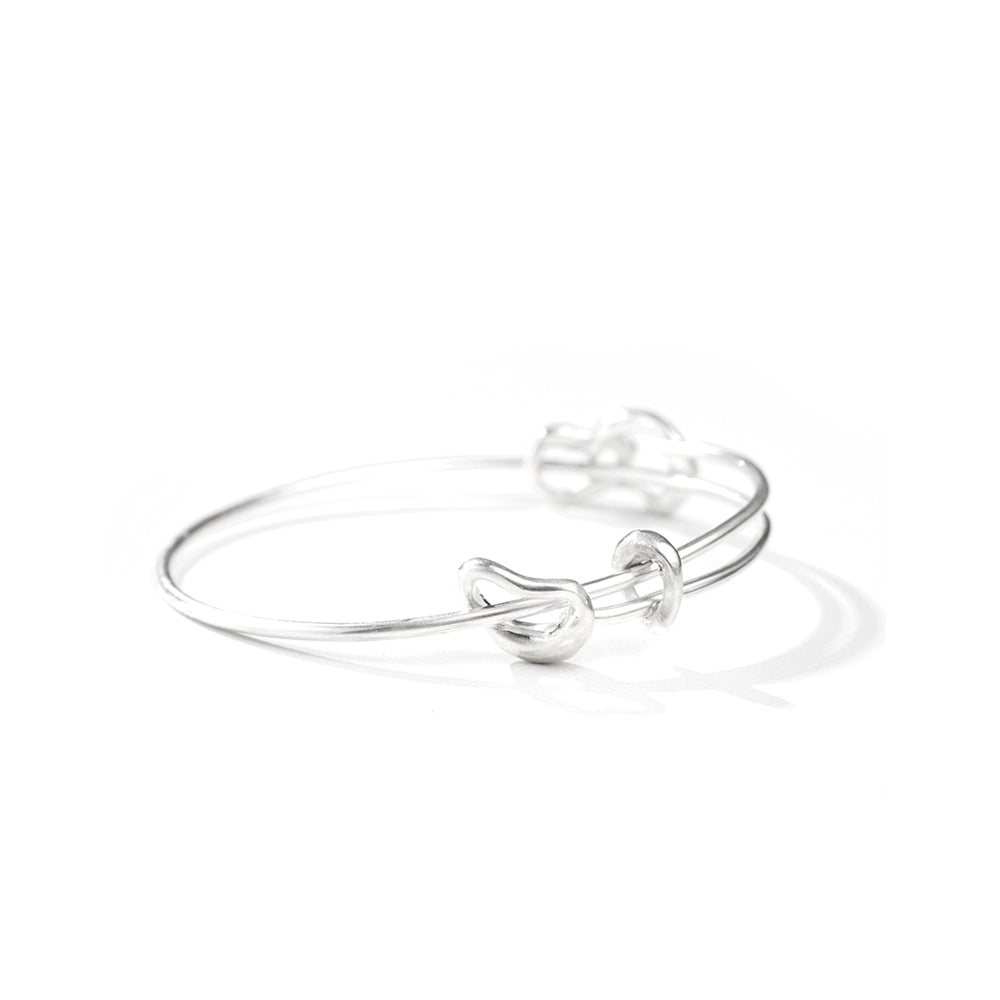 hana kim Bangle made from recycled silver, laid down