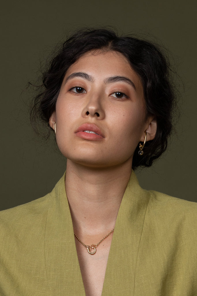 hana kim recycled silver Drop Earhugger gold plated set with a Swiss quartz crystal