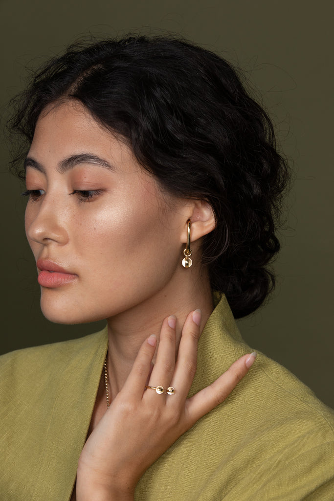 hana kim recycled silver Drop Earhugger gold plated set with a Swiss quartz crystal